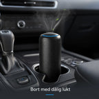Vindren Billuftrenare i svart i bilens mugghållare